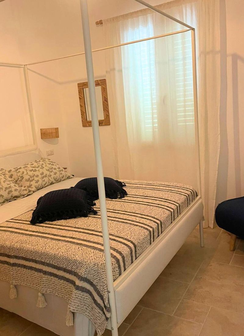 camera-da-letto-casa-lu-mare